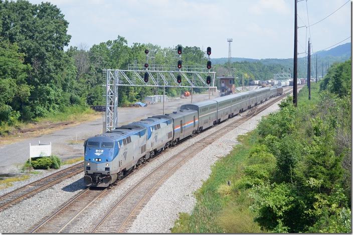 Amtrak No. 30, the National Limited, behind 120-19 passes Mexico Tower at the east end of the Cumberland Terminal SD at 11:40 AM. Amtrak 20-19. Mexico MD.