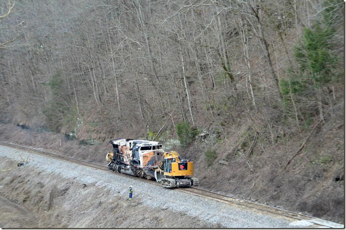 After dragging it up from the river bank, a B&P Enterprises excavator slowly pulls CSX 571 to its final resting place. CSX derailment. Draffin KY. 02-17-2020.