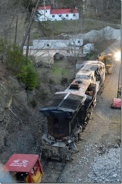 CSX 571 was moved below the crossing. It was lowered to the stone pad the next day. CSX derailment. Draffin KY.