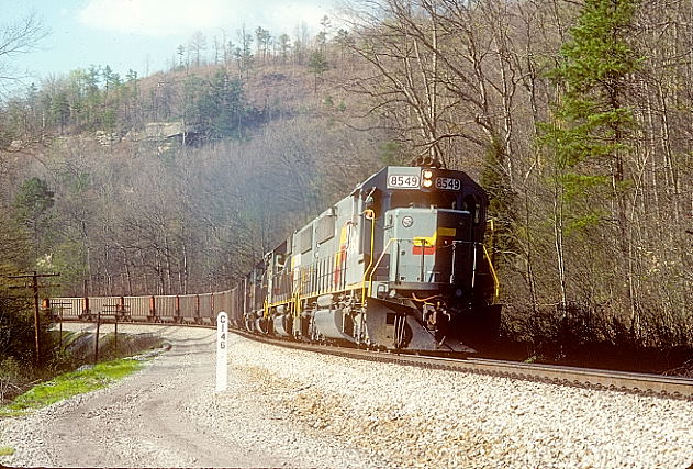 Hazel. CSX SD50s 8549-8546 with SD40-2 8211 and GP38-2 2596 get a run at Crooked Hill at Hazel Patch.