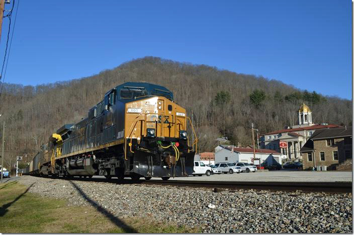 CSX 107-507 pass through Madison WV with the Boone County court house in the background.