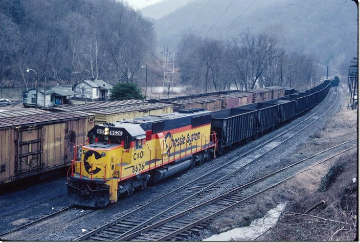 I scanned these slides recently, so I thought I would share them with you. E/b “Buffalo-Lundale” with 35 empties going into the siding at Taplin to meet Ex6525 West on 02-19-1986. C&O. Taplin WV.