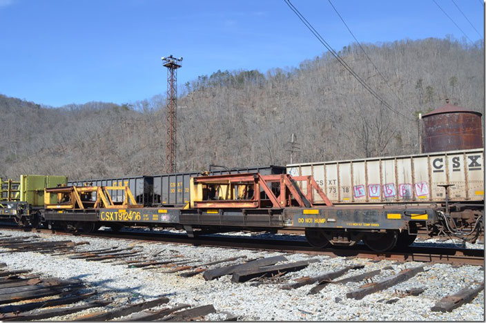 CSX MW flat 912406 looks like its function is to guild the rail being laid. Shelby KY.