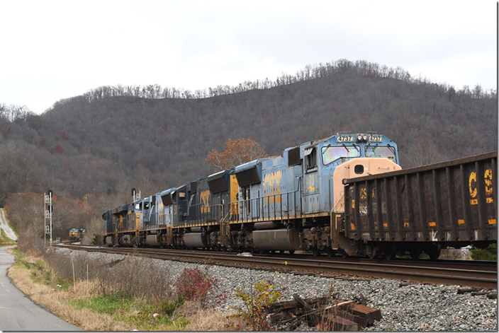 Our w/b manifest has a clear signal at Beaver Jct. where he is meeting an opposing manifest. CSX 3205-743-4739-4751-4737. Beaver Jct KY. 11-18-23.
