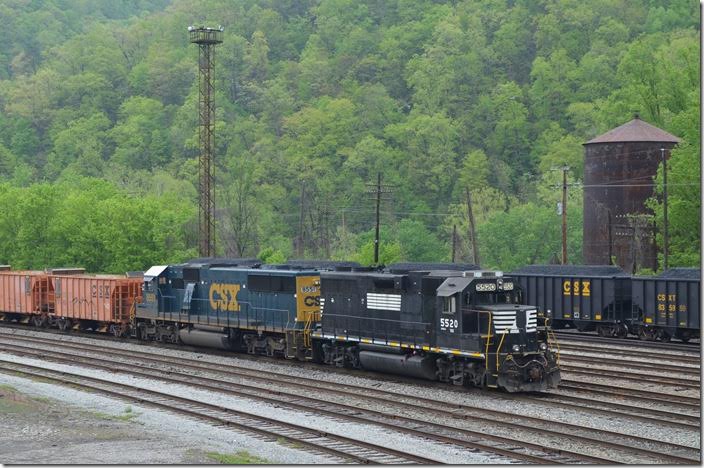FURX 5520-CSX 8551 on empty ballast train. 04-26-2015. That water tank is the last steam-era structure left at Shelby.