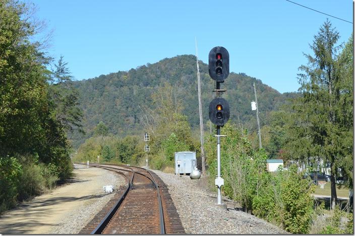A CSX approach signal at the east end of Shelby indicates something is coming. The switch is lined for the main, and the signal at the west end of Shelby will be red.