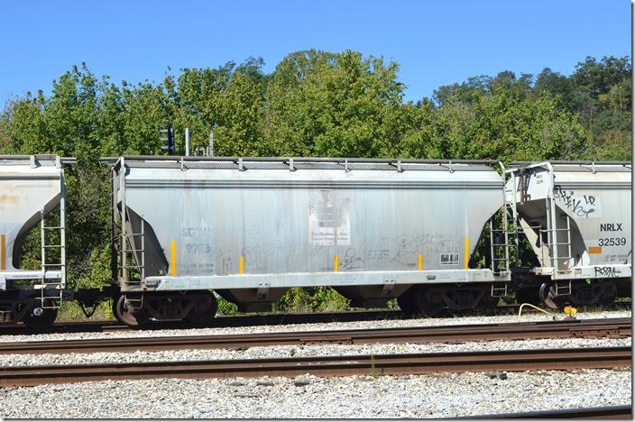 SDMX (Southdown Inc. Cement Producers Group or CEMX Inc.) covered hopper 9776 was built by Tharall in 1997. Shelby KY.