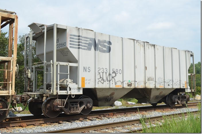 NS covered hopper 233580 has a load limit of 201,300 lbs, a volume of 3,000 cubic feet and was built 08-1980. It is in NS class HC-77. I found it at Titan America (Roanoke Cement) at Lone Star VA with a load of cement destined for Selma NC on 08-25. Lone Star Cement was the original or previous operator of the large plant. Lone Star VA.