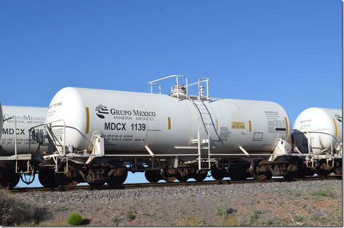 Plenty of sulfuric cars parked in the UP yard/Arizona Eastern interchange at Lordsburg NM on 04-30-2019. Built 02-1990. Sulfuric acid is used to leach minerals out of copper mine waste dumps. MDCX tank 1139. Lordsburg NM.