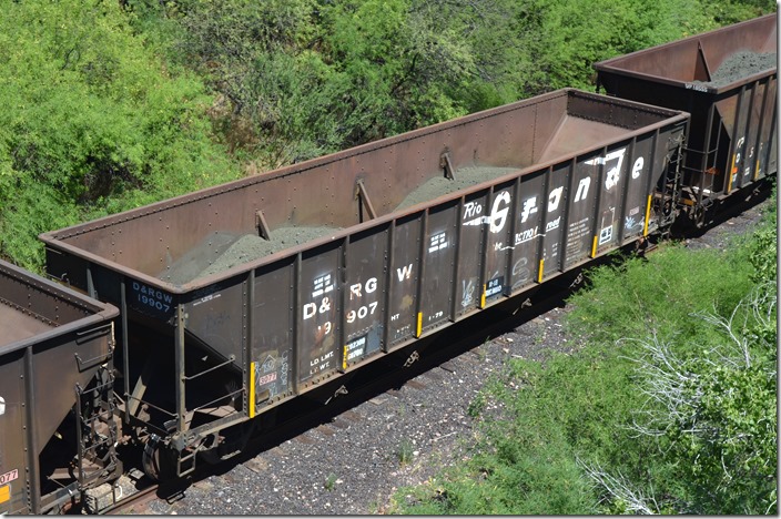D&RGW hopper 19907 has a load limit of 202,300 and a capacity of 3483 cubic feet. It was built by Bethlehem Steel 01-1979. Note the stencil “Do Not Load Above Line” referring to 3077 placard cars in ore service. Kelvin AZ.