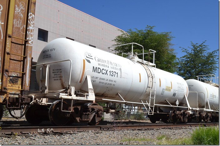 All MDCX tankers had “1830” placards indicating sulfuric acid. This UP freight was going into Mexico. MDCX tank 1371. Nogales AZ.