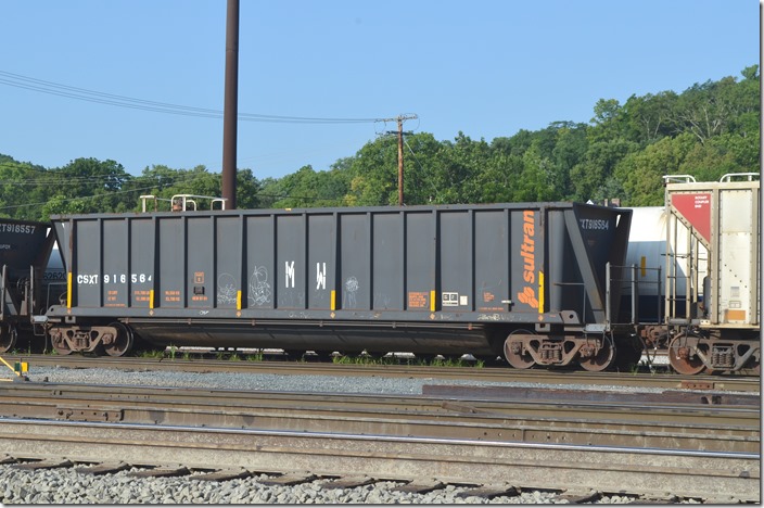 CSXT MW 916564 has a volume of 4400 cubic feet, a load limit of 210,700 lbs and was built in 07-1991. These are used to transport scrap ties. Queensgate Yard. 08-02-2019. Queensgate OH.