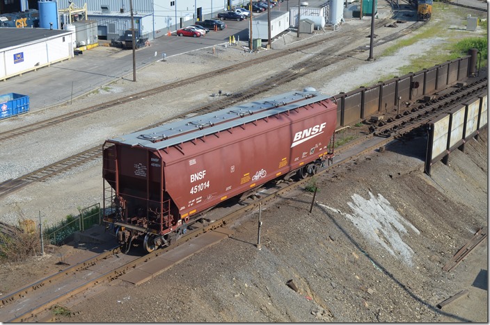 BNSF covered hopper 451014 appears virtually brand new. It has a load limit of 223,100 lbs. Queensgate OH.