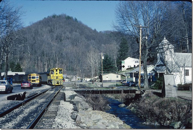 School busses have to wait for trains in Mammoth WV. KC&NW 1. 1990.