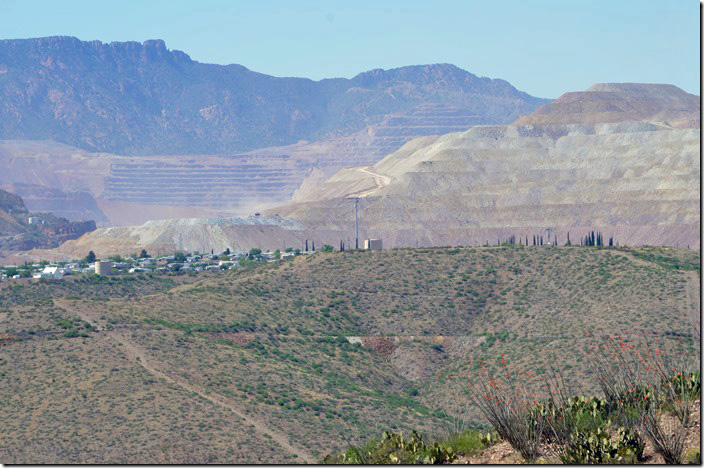 Behind the town, the huge copper mine pit dominates everything. View from US 191 of Morenci AZ.