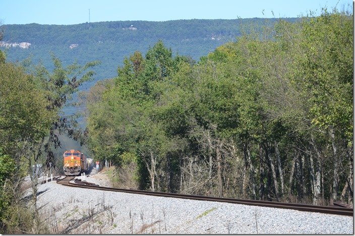 We had to head for home, but I pulled off the I-59 several miles toward Chattanooga to catch one of the three southbounds that 164 was waiting on at Fort Payne. We parked in the shade, and after a short time freight 129-04 (Chattanooga to Birmingham) charged by. BNSF 5423-NS 6911-6670-9084 was in command of 48 loads and 63 empties at Rising Fawn GA.