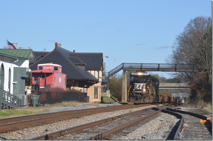 NS 8878-8886 bring w/b empty stack train 23Q-12 (47 bare-tables from Williamson WV to Atlanta) through Abingdon VA, on the former N&W Pulaski District. Abingdon VA. 12-03-2015.