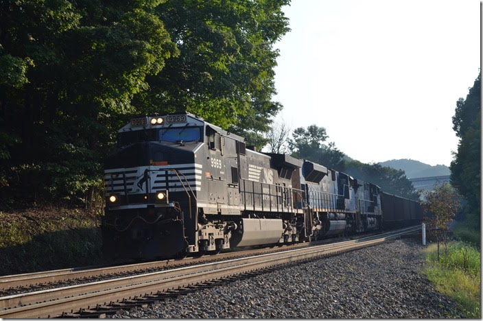 I headed for the old US 460 underpass on the steepest part of the grade between Ada and Bluefield yard. That’s new US 460 in the background. An eastbound Progress Energy (PGNX) coal train drifted down hill behind NS 9969-PRLX 4836-NS 4131. NS 9969-PRLX 4836-4131. Ada WV.