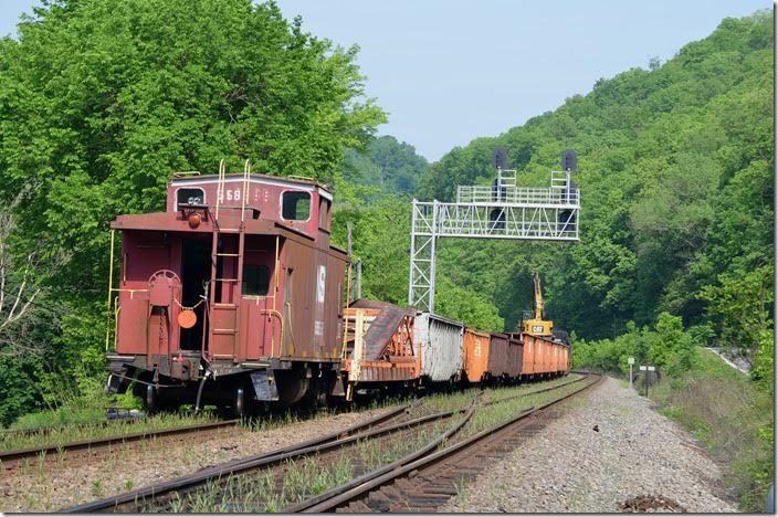 Work train 97J with NS caboose 555585 unloads ties at Naugatuck.