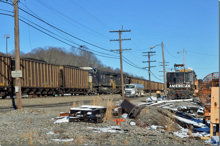 Mid-train DPUs being refueled by truck near the site of the old freight depot. NS 4368-4038 DPU. Bluefield WV.