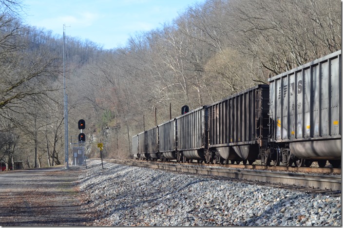 The automatic signal at Vulcan indicates 233 is still in the second block ahead. 824-19 is stopped on Main 2. NS signal. Vulcan WV.