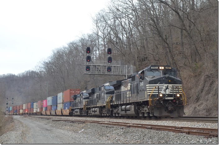 I headed back up to the east end of the yard at Rawl WV. It was getting late, but trains were coming. First is eastbound 236-14 (Rickenbacker OH – Norfolk) behind NS 9101-8125-9975 with 27 vans.