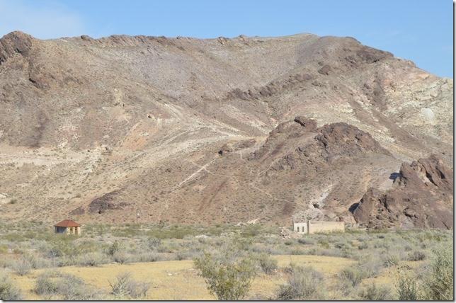 Looking east where many frame buildings and houses stood for such a short time in history. There is an active mine on the other side of the hill. Rhyolite NV.
