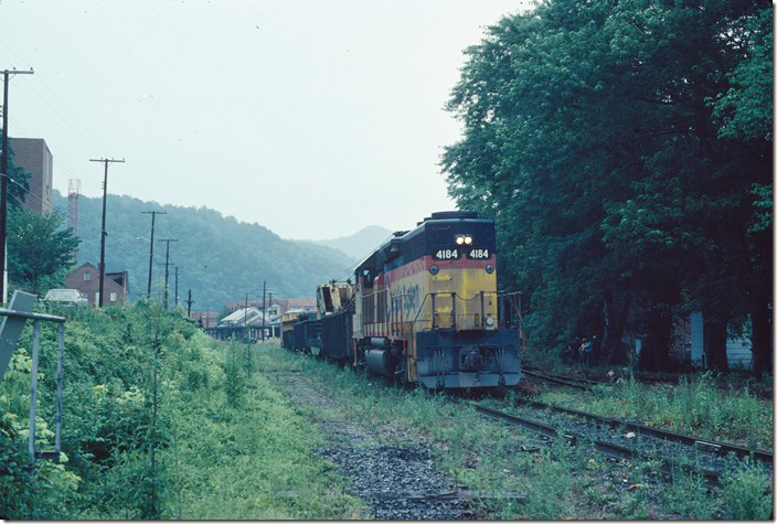 Two years later on 06-25-1980 a work train removes the abandoned former C&O main line track through downtown Pikeville. The passing siding on the left has already been taken up. In a few years Hambley Blvd. and the Hilton and Hampton Inn hotels would dominate this scene. C&O in Pikeville KY.