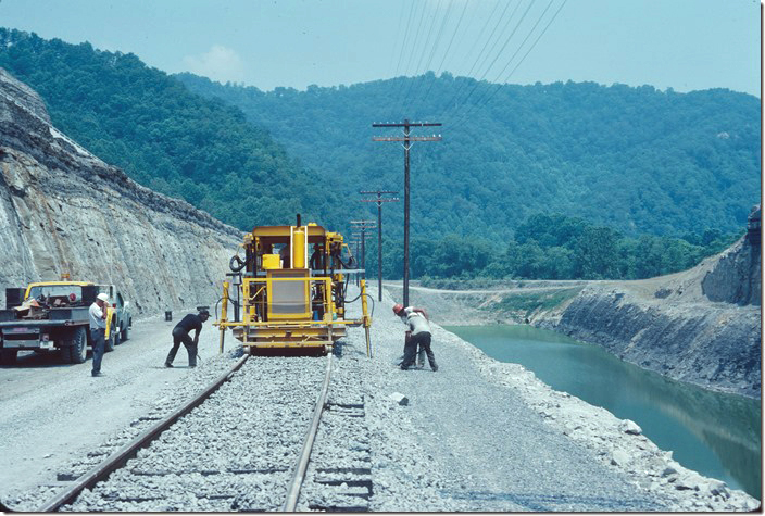 Tamping ballast around the ties. 07-01-1978. C&O in Pikeville KY.