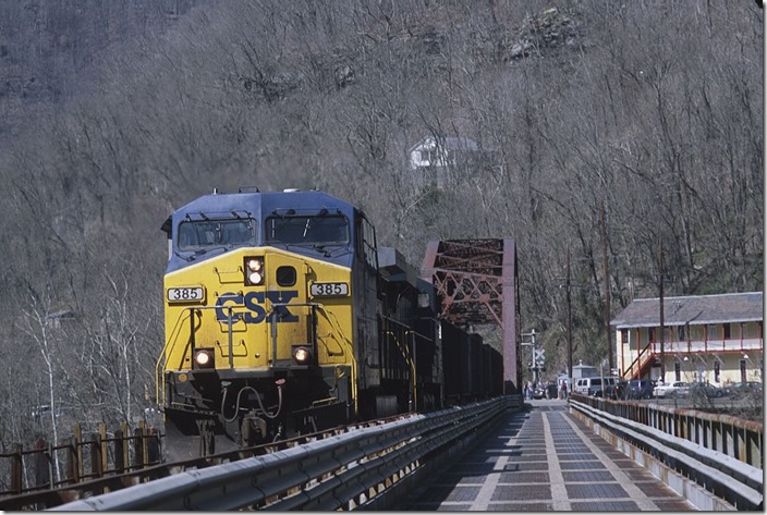 R. J. Corman Railroad train Z549-06 rumbles across the New River to South Side Jct. View 2. 