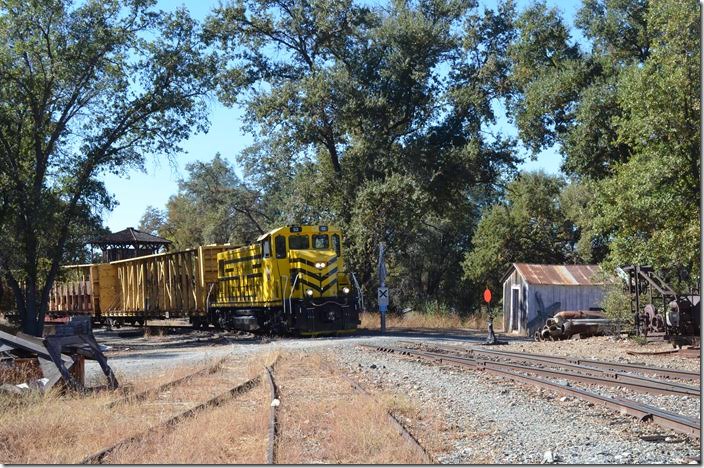 I heard a horn coming from the south. Soon Sierra Northern Railway 52 ambled through the junction. Jamestown CA.