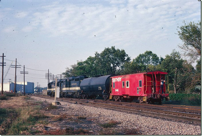 I believe the Southern got on BN for a short distance to cross the Illinois Central Gulf main in the background. I spent part of two and a whole day shooting around Centralia. 09-25-1981.