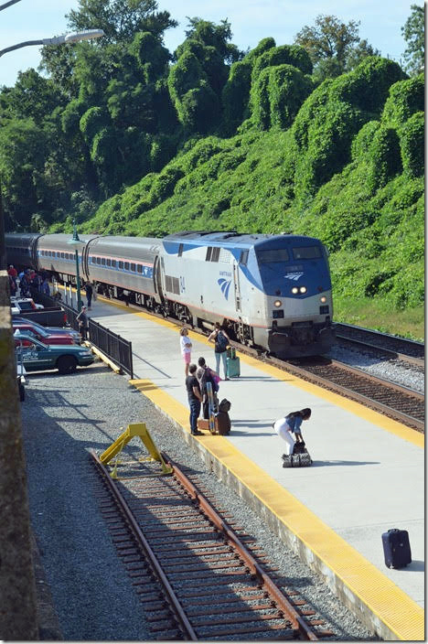 Amtrak No. 16 northbound arrives Lynchburg 9:59 AM (runs later on Sat. and Sun.) from Roanoke behind engine 84 and 8 cars. Saturday, 08-25-2018. Lynchburg VA.