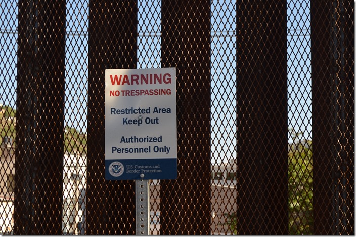 Nogales AZ border wall warning sign.