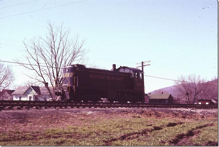 On April 8, 1971 I crossed the bridge from Cumberland to Ridgeley WV, location of Western Maryland’s yard in the area. Quickly I found S-2 143 near the west end of the yard. Western Maryland didn’t have much of a steam switcher fleet; 0-6-6-0s, 0-8-0s converted from 2-8-0s, and small 0-6-0s. Therefore all of their early diesels were switchers bought during and just after WWII. No. 143 came in 1946. WM Ridgeley WV.